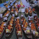ตักบาตรท่าคา พระ 299 รูป โดยพายเรือ ณ ตลาดน้ำท่าคา อ.อัมพวา